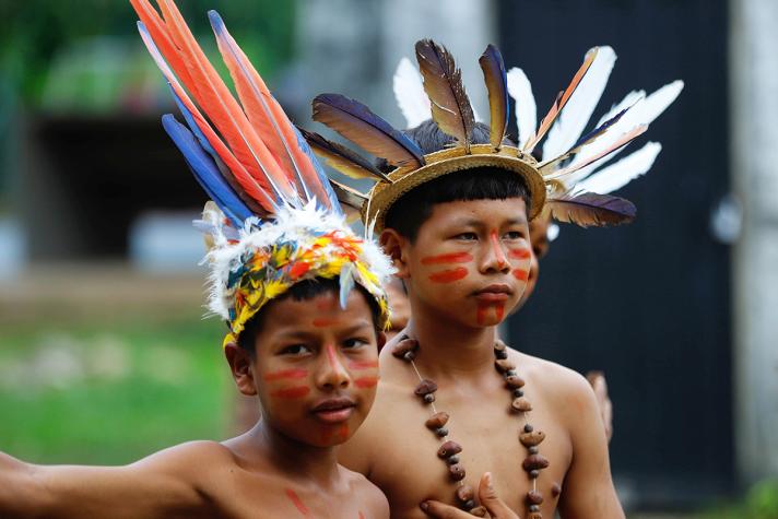 Photo of 2 children with tradional headdress